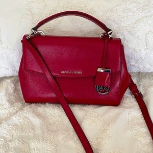 Michael Kors red purse with magnetic closure